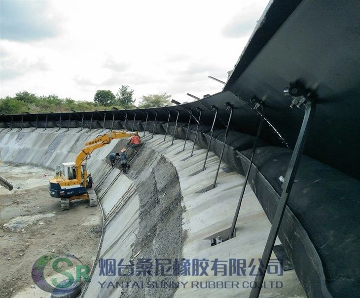 Pneumaattinen spillway-portti puhallettavalla kumirakolla